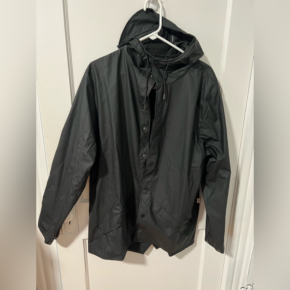 Black M RAINS jacket. Unused